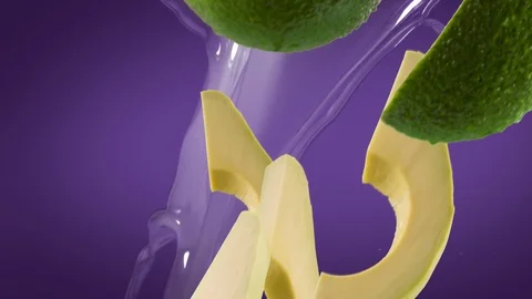 Avocado with Slices and Splash Falling on Purple Background Video stock 122704097
