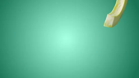 Avocado with Slices falling on turquoise background Stock Footage 130671910