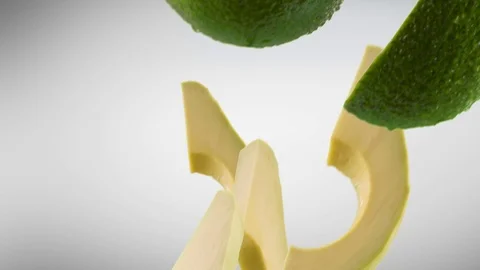 Avocado with Slices Falling on White Background with Luma Matte Vídeos de archivo 122704747