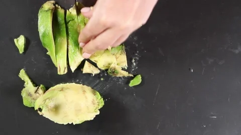 Avocado slicing on gray background close-up top view Video stock 132791338
