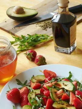 Avocado with strawberries Stock Photos