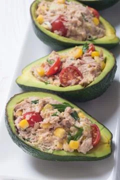 Avocado stuffed with salad Stock Photos