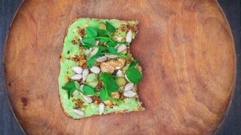 Avocado toast eating bite by bite. Loop stop motion animation. Healthy food Stock Footage 129244794