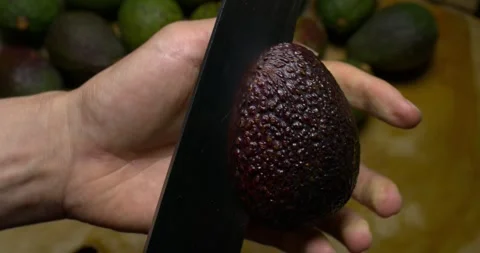 Avocados being opened 60 fps slow motion Stock Footage 301017278