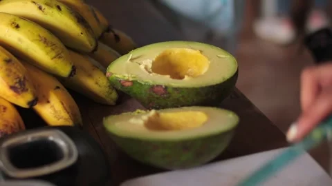 Avocados in the kitchen slow motion Stock Footage 249609285