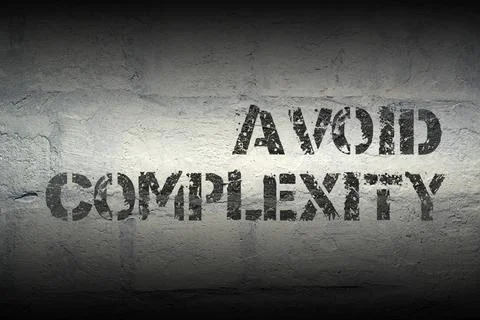 Avoid complexity GR avoid complexity stencil print on the grunge white bri... Stock Photos
