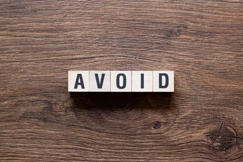 Avoid - word concept on building blocks, text Stock Photos