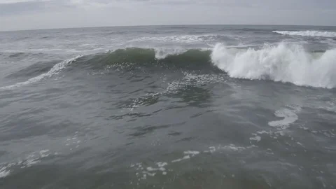 Avoiding the crash of the waves Stock Footage 74062214