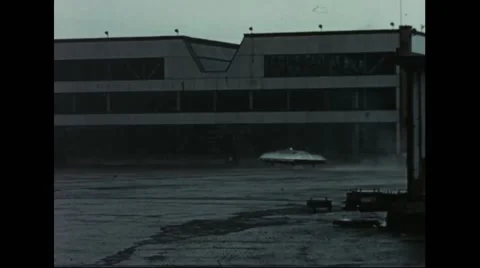 Avrocar hovering over concrete ground Stock Footage