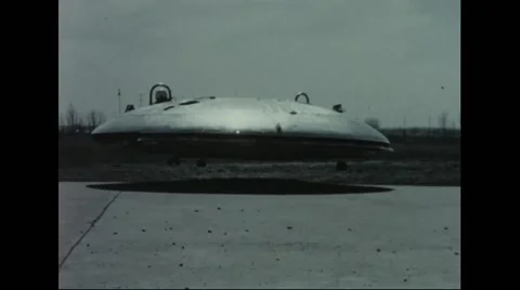 Avrocar hovering over terrain Stock Footage