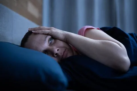 Awake Woman With Insomnia In Bed Stock Photos