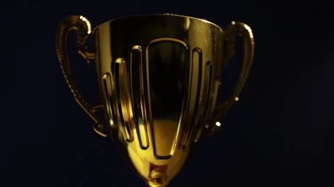 Award cup, prize for the winner of the competition in the spotlight Stock Footage 254875491