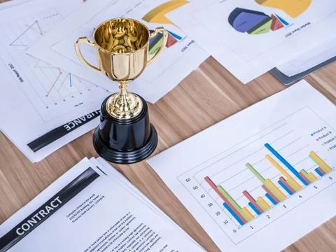 Award trophy on working table with document and contract Stock Photos