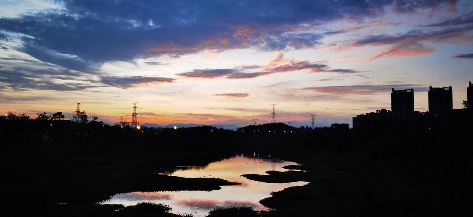 Awe-inspiring sunset paints the sky in vibrant hues Stock Photos