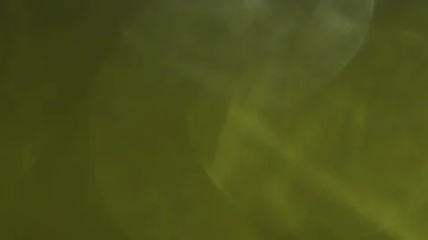 Awesome 4k yellow loopable background. Light leaks pulses in the dark. Stock Footage 100128471