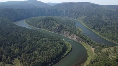 Awesome aerial view of river loop among evergreen woods Stock Footage 169339177