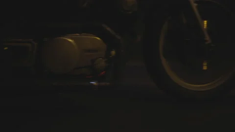 Awesome Closeup Shot of a Motorcycle Front Wheel on a Dark Background Stock Footage 157370546
