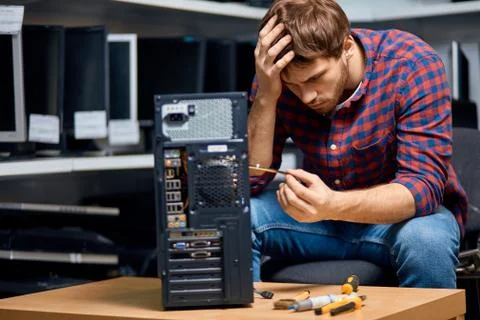 Awesome guy thinking about PC repairing 스톡 사진