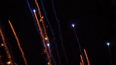 Awesome multi-colored launch of multi-colored fireworks in the night sky Stock Footage 115495021