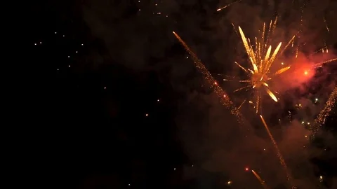 Awesome multi-colored launch of multi-colored fireworks in the night sky Stock Footage 115495077
