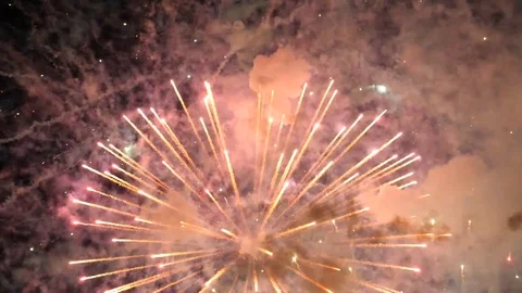 Awesome multi-colored launch of multi-colored fireworks in the night sky Stock Footage 115495365