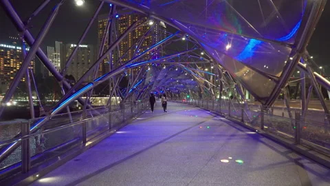 Awesome night view of the Helix Bridge in Singapore Stock Footage 277125876