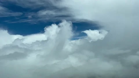 Awesome pilot point of view flying a jet through clouds avoiding bad Video stock 198349409