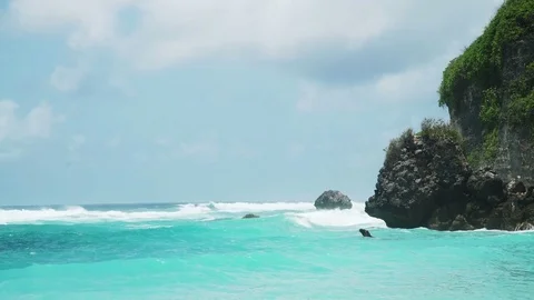 Awesome power of giant waves breaking over rocks Stock Footage 83702936