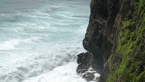 Awesome power of giant waves breaking over rocks in Uluwatu Bali Stock-Footage 83708378