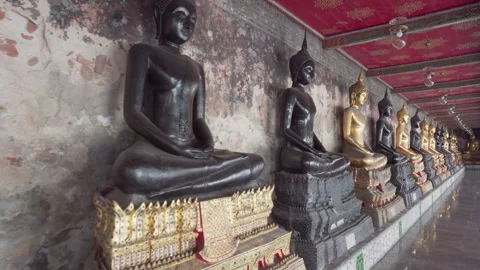 Awesome row of Buddha statues in Wat Suthat Thepwararam, Bangkok Stock Footage 248808033