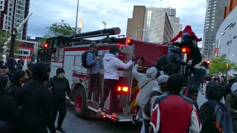 Awesome scene of protesters hooking firetruck in mouvement Stock Footage 132477321