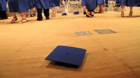 Awesome shot of Graduation Cap Being Picked Up After Ceremony Stock Footage 34545375