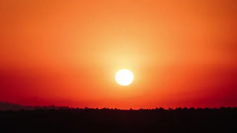 Awesome Sunset Moving Down in the Orange Sky with Soft Clouds, Timelapse Stock Footage 253381413