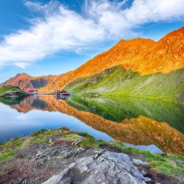 Awesome sunset view of Balea glacier lake near the Transfagarasan road. Stock Photos