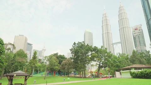 Awesome view of the KLCC Park and Petronas Twin Towers Stock Footage 249398313
