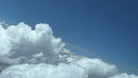 Awesome view of a sky covered with tiny white cumulus clouds during a left Stock Footage 246366162