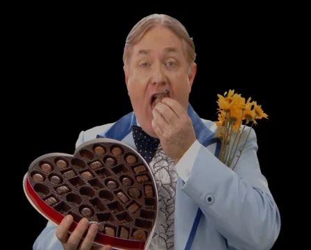 Awkward Man eating Valentine's Candy Stock Footage 5163539