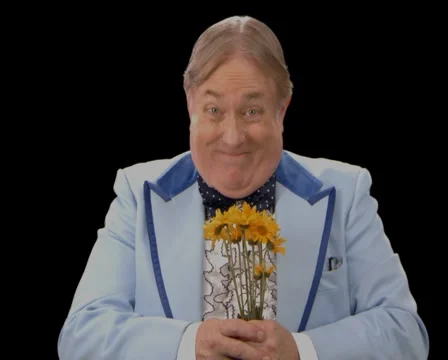 Awkward Man presenting Flowers Stock Footage 1042515