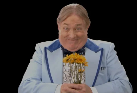 Awkward Man presenting Flowers Stock Footage 5163535