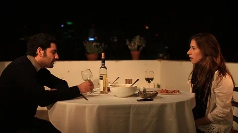Awkward silence during dinner couple Stock Footage
