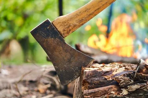 Ax on the background of a burning fire Stock Photos