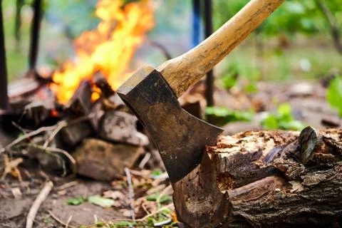 Ax on the background of a burning fire Stock Photos
