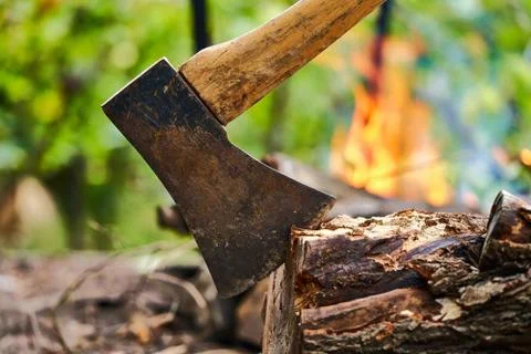Ax on the background of a burning fire Stock Photos