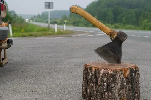 Ax on the background of the road Stock Photos