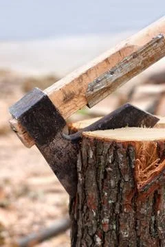 Axe chopping log Stock Photos