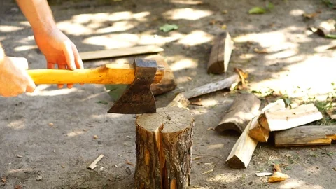 Axe cuts wood Stock Footage 94831324