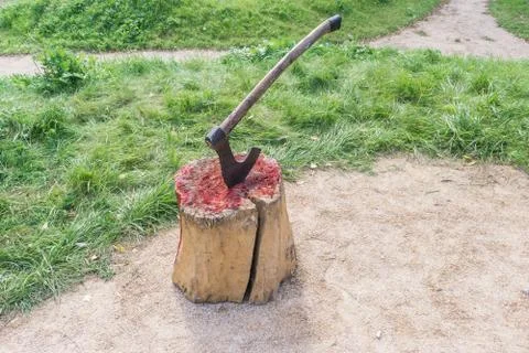 Axe of executioner from middle Ages. Beheading on medieval festival. Victim's Stock Photos