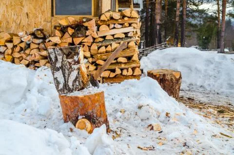 Axe for firewood in winter Stock Photos