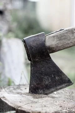 An axe in a log in the open air. Cooking for chopping wood. Stock Photos