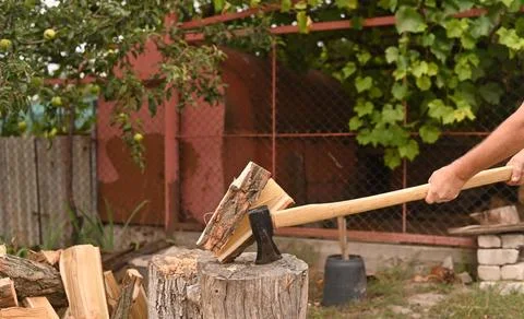 The axe split the log in two. Stock Photos